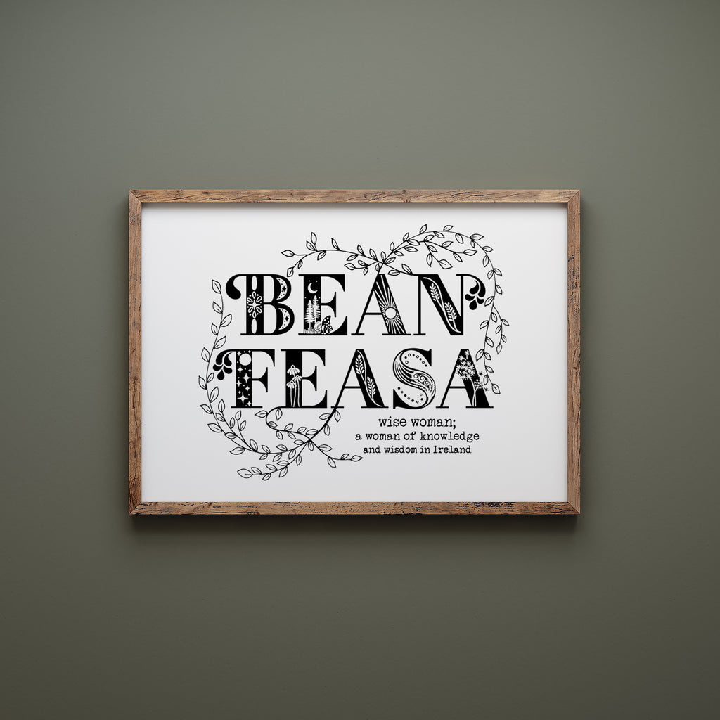 Bean feasa screen print in a wood frame hanging on a green wall