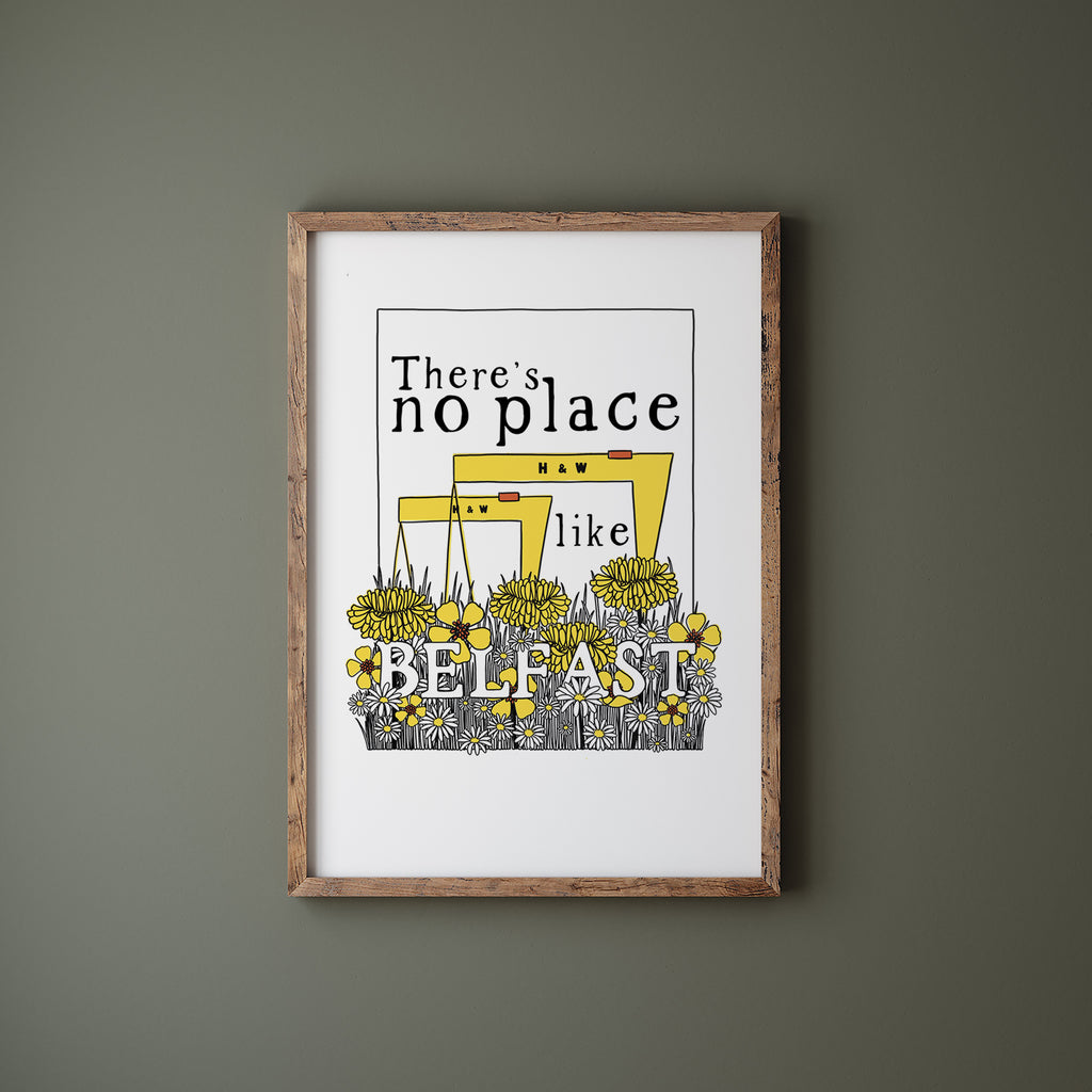 Belfast screen print in a wood frame hanging on a green wall