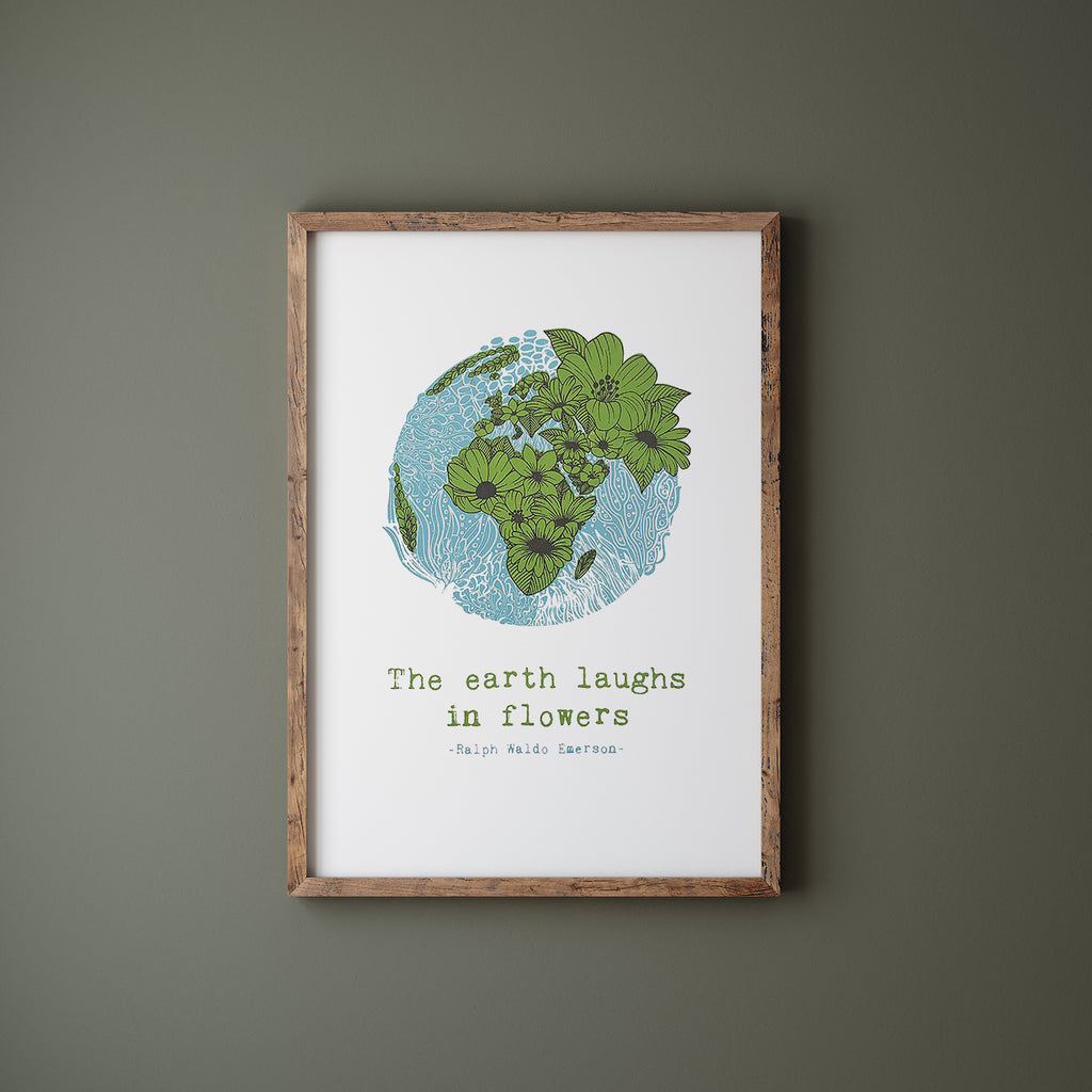 Floral earth screen print in a wood frame hanging on a green wall