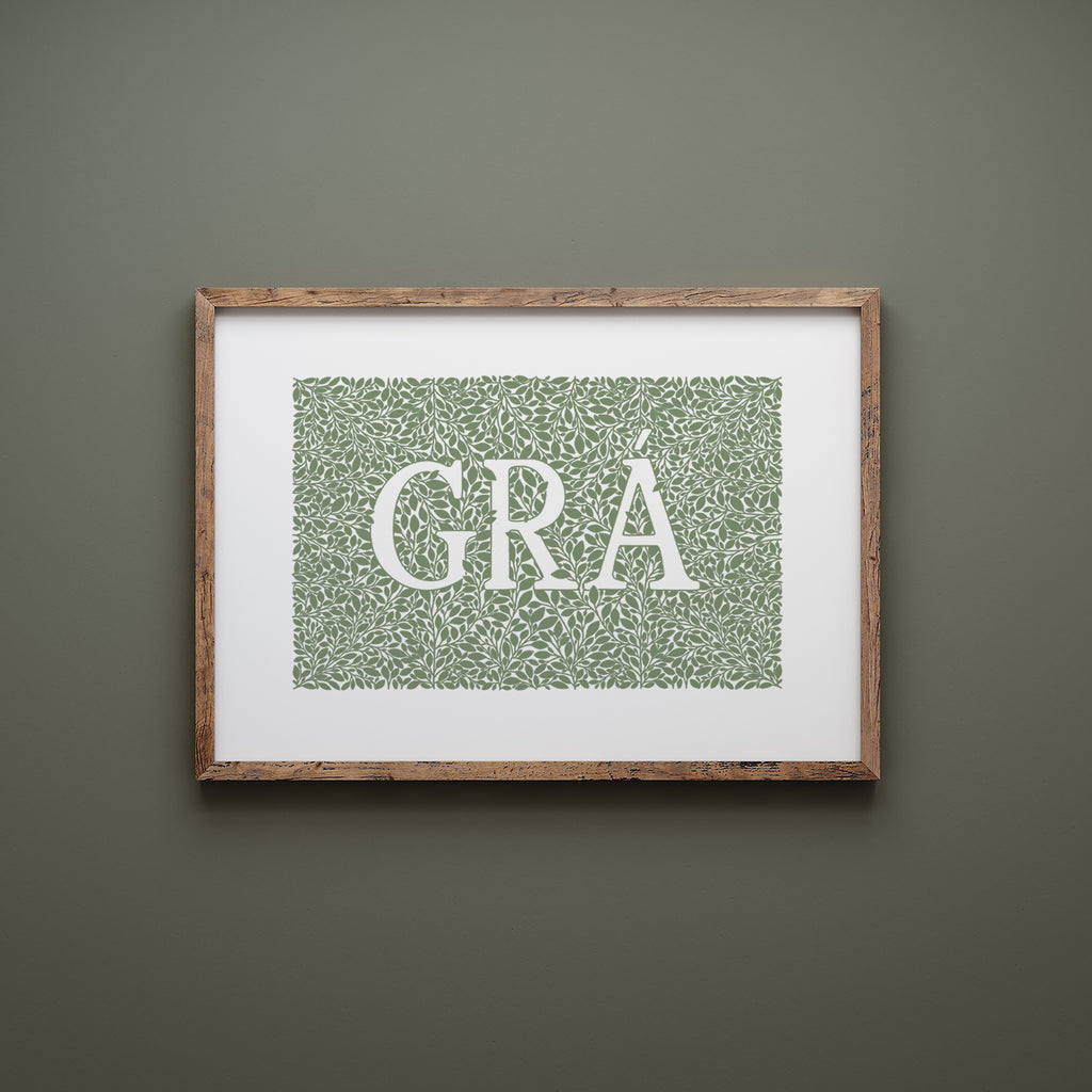 Green grá screen print in a wood frame hanging on a green wall