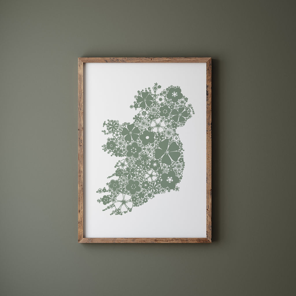 Green floral Ireland in a wood frame hanging on a green wall