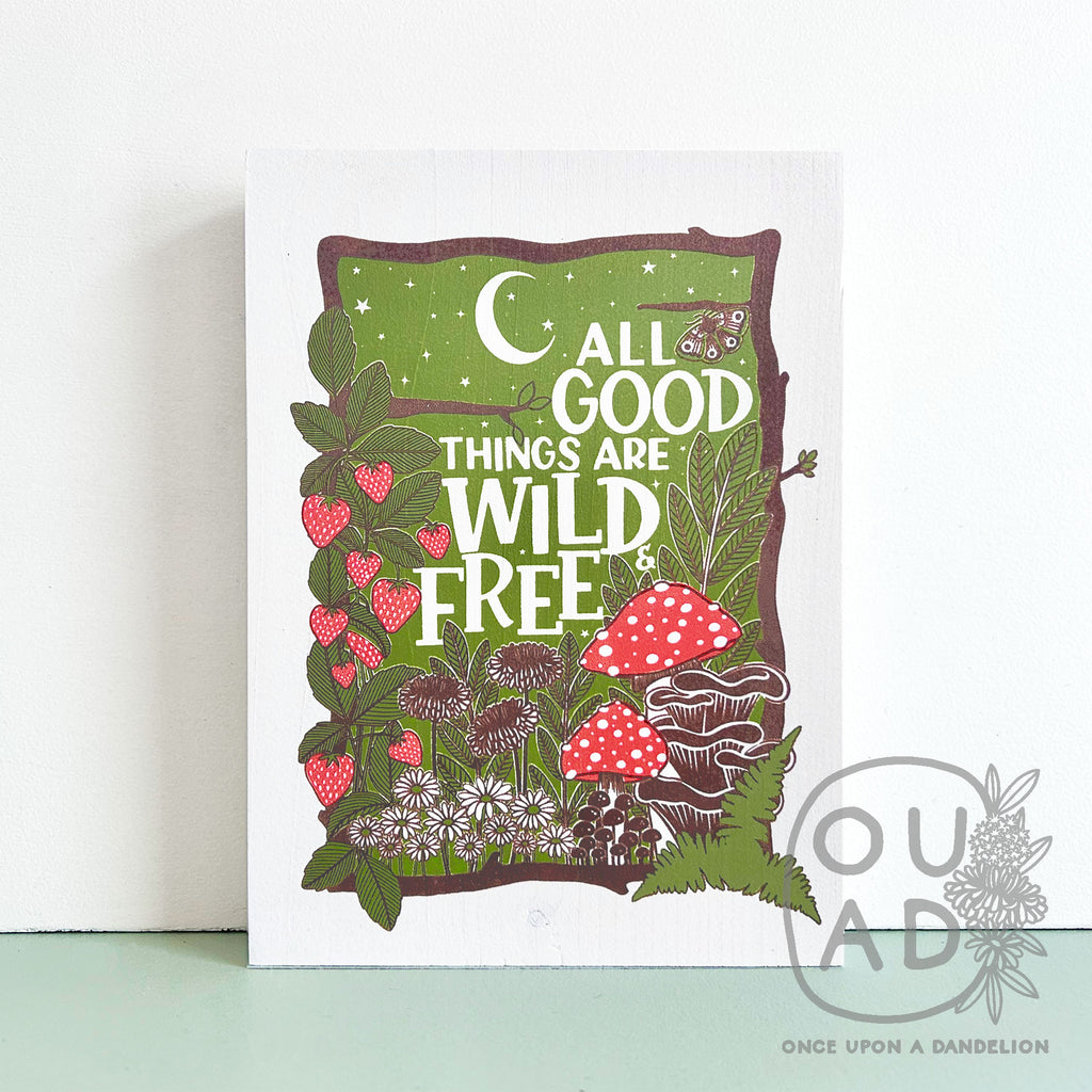 All good things are wild and free, screen printed in 3 layers, brown, green and red on a painted white wood sign.