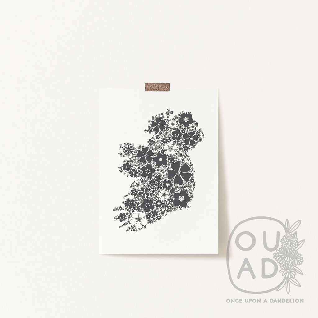 Grey floral Ireland screen print stuck to a wall with tape