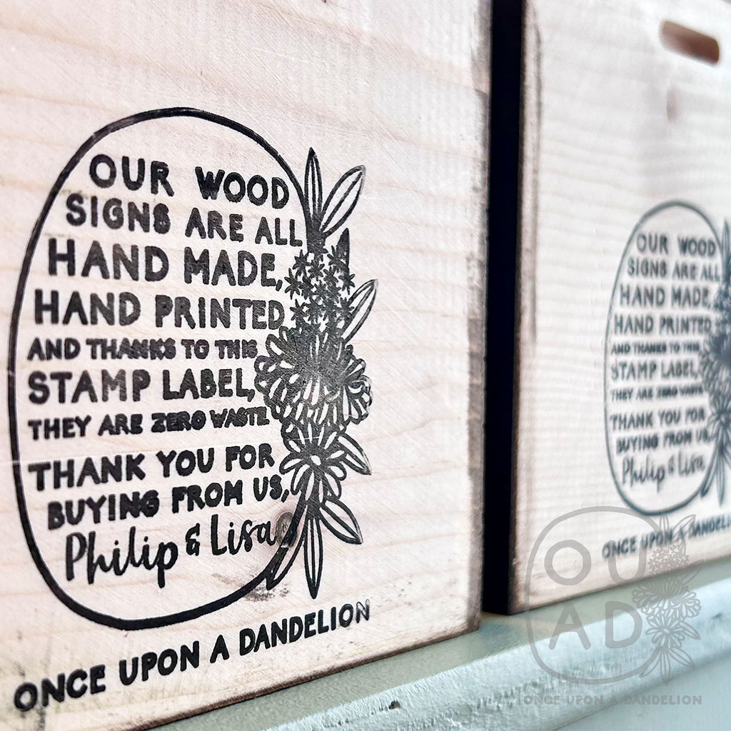 A photo of the back of our hand made wood signs, hand stamped with details instead of a label.